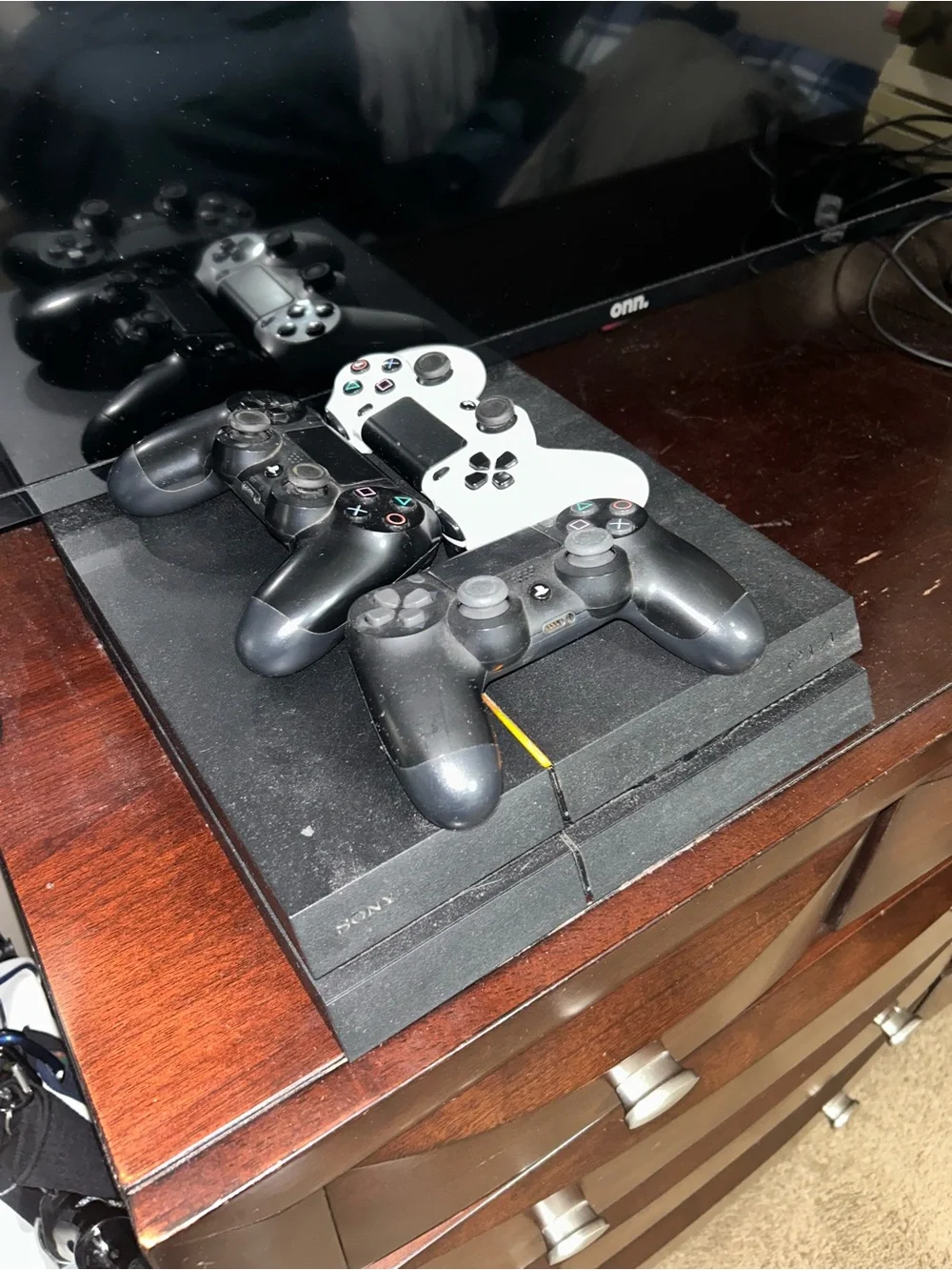Sony PS4 Console with 2 Black and White DualShock Controllers
